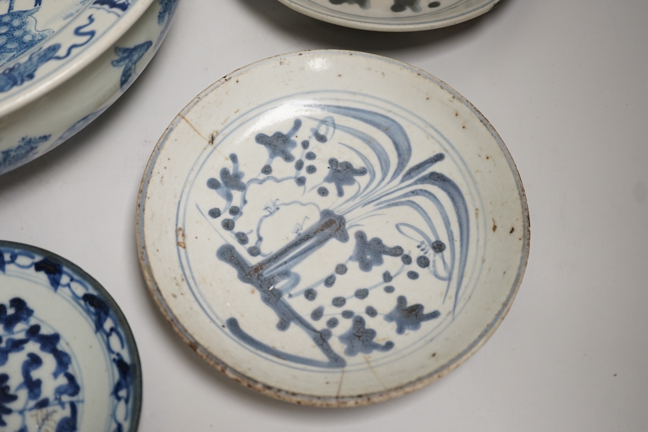 A Chinese blue and white bowl, tea bowl and saucer, and two other dishes, largest 29cm diameter